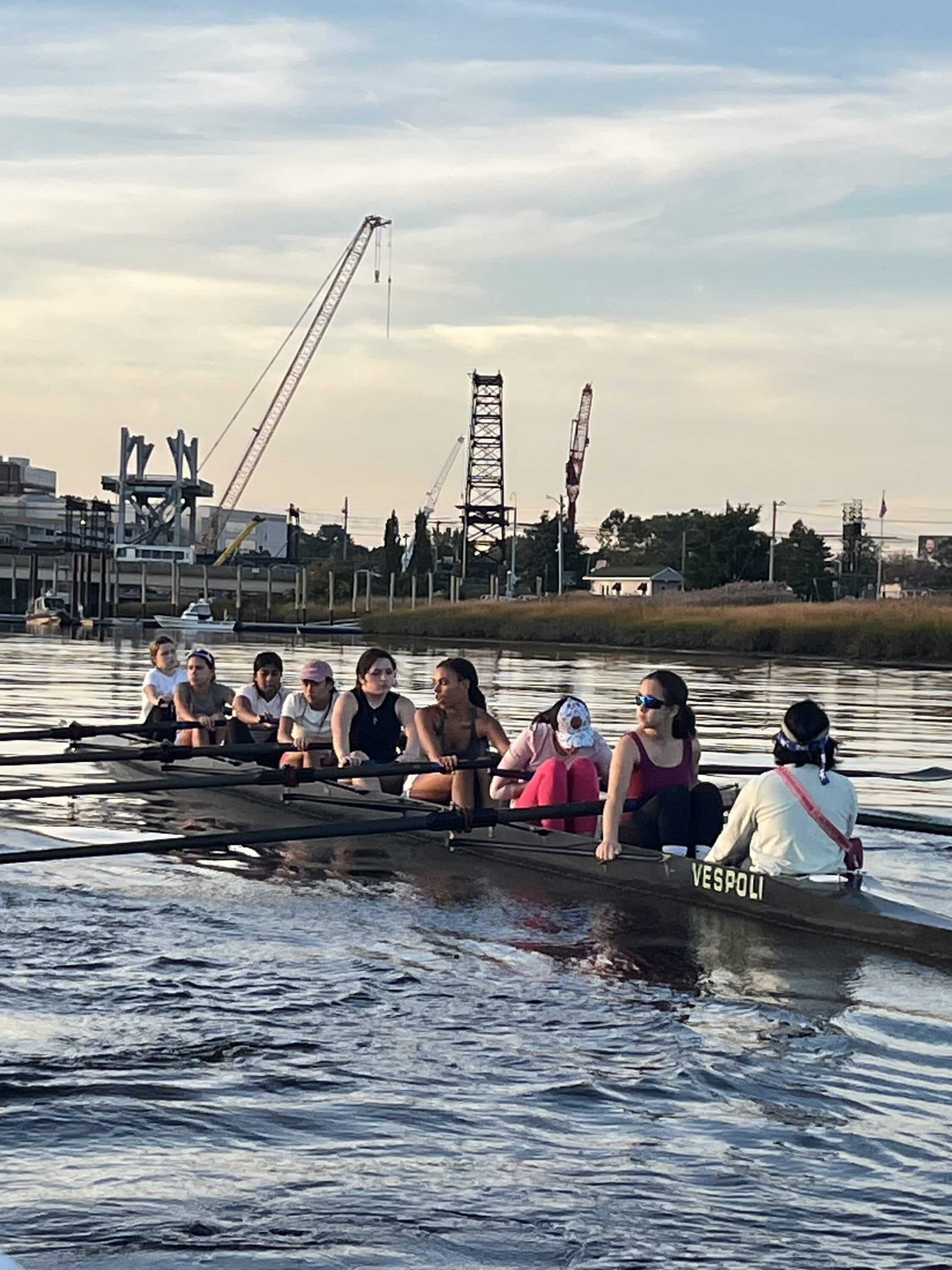 Connecticut Boat Club Development Team rowers in an eight on the Norwalk River