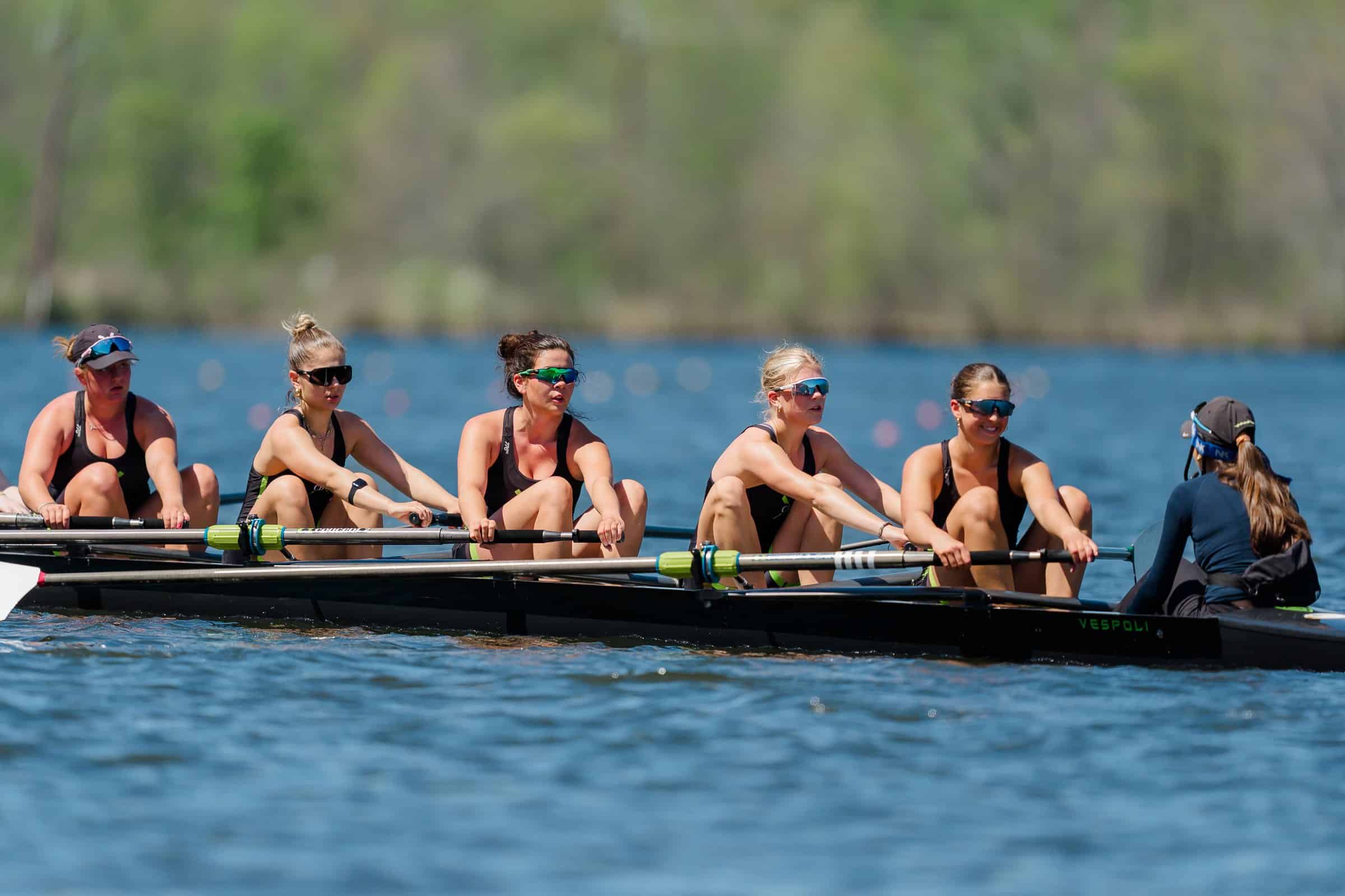 A CBC eight smiling on the water before a race at Mercer